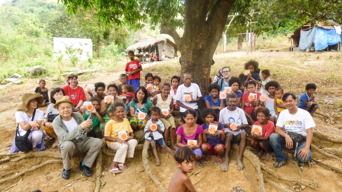 Arriving at the Aeta community. The small orange objects everybody holds are the solar-panel lights which are saving the community a lot each year!